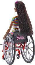 Load image into Gallery viewer, Barbie Fashionistas Doll #166 with Wheelchair &amp; Crimped Brunette Hair Wearing Rainbow-Striped Dress, White Sneakers, Sunglasses &amp; Fanny Pack, Toy for Kids 3 to 8 Years Old [Amazon Exclusive]

