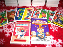 Load image into Gallery viewer, 2013 GARBAGE PAIL KIDS BRAND NEW SERIES 3 {BNS3} LOT OF THIRTY DIFFERENT STICKERS + 2 CEREAL KILLER STICKERS. by Garbage Pail Kids
